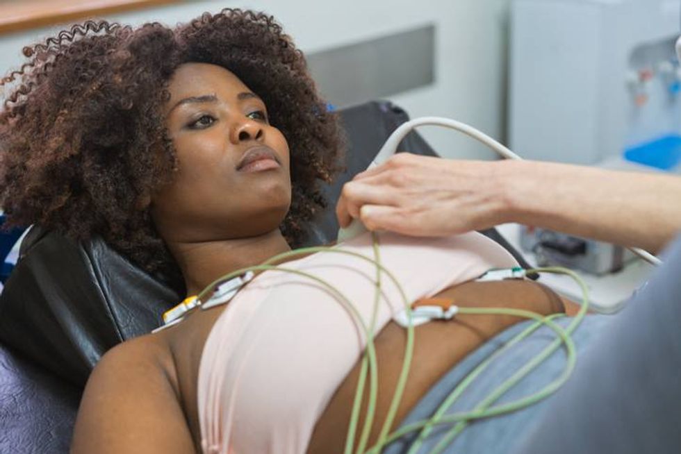 Doctor doing ECG exercise test at examination room