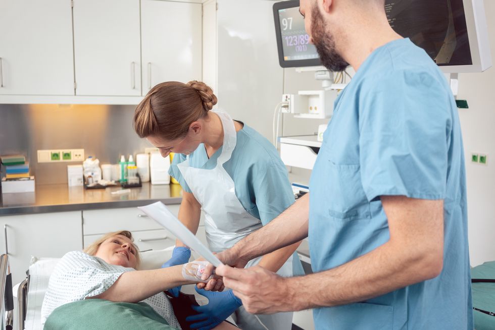 Doctor greeting patient in a hospital before her colonoscopy