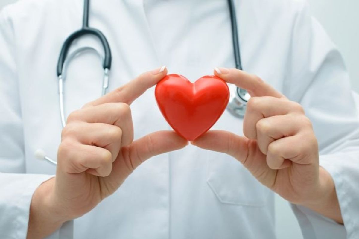 doctor holding a heart 