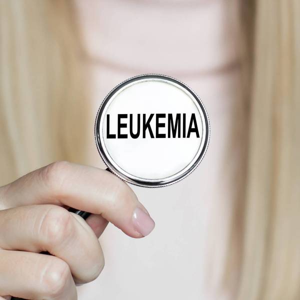 Doctor holding stethoscope on which word LEUKEMIA
