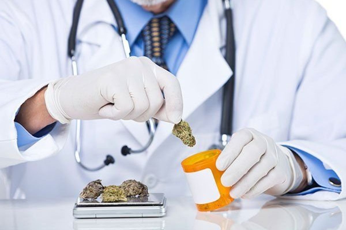 doctor putting marijuana in a prescription bottle