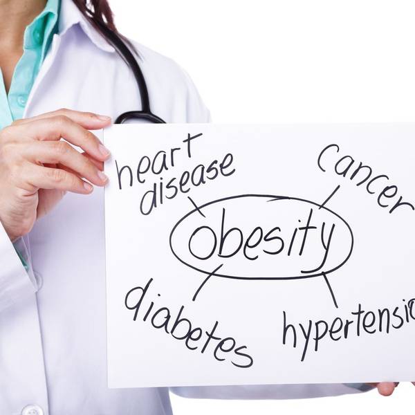 doctor showing the consequences of obesity