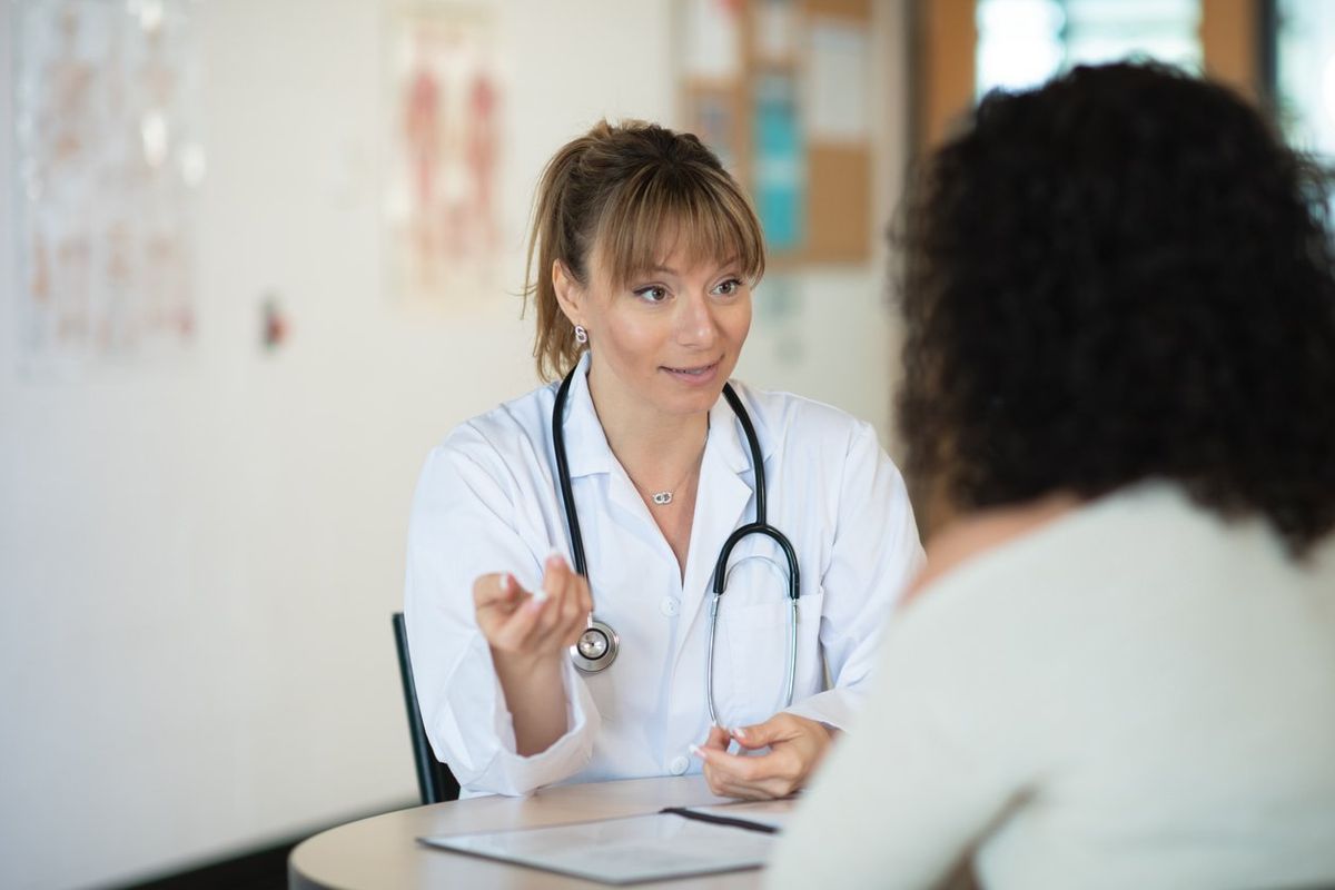 Doctor speaking to patient