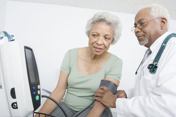 doctor taking blood pressure