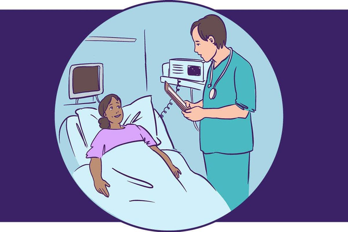 doctor talking to patient lying down getting ready to have a colonoscopy