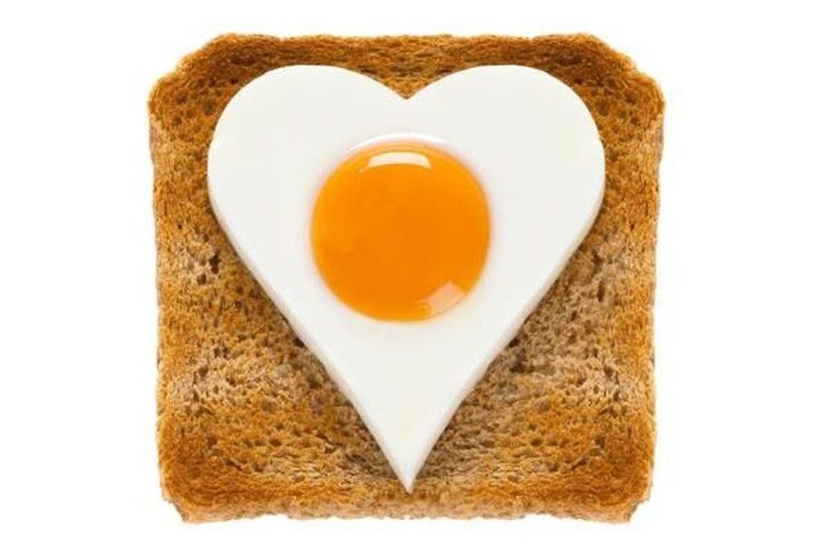 egg in the shape of a heart on a piece of toast