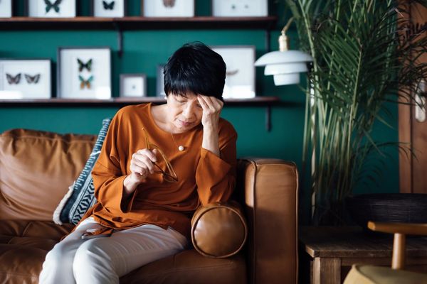 enior Asian woman feeling tired