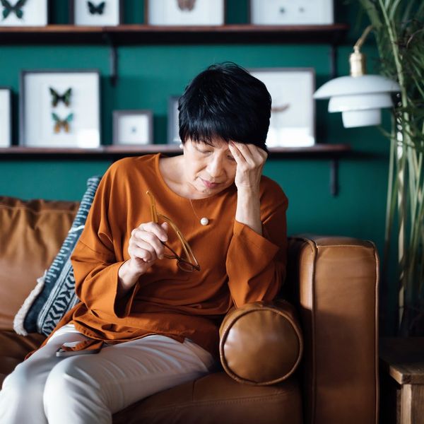 enior Asian woman feeling tired