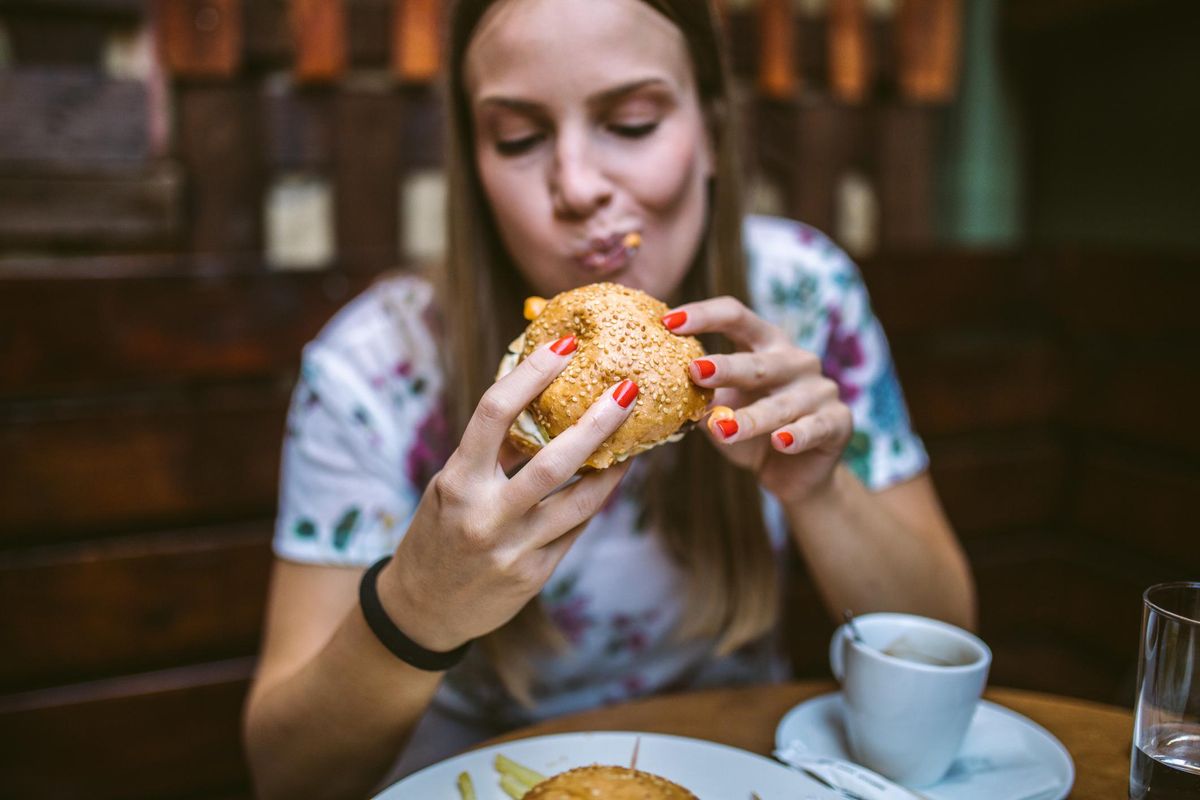 woman eating a burger
