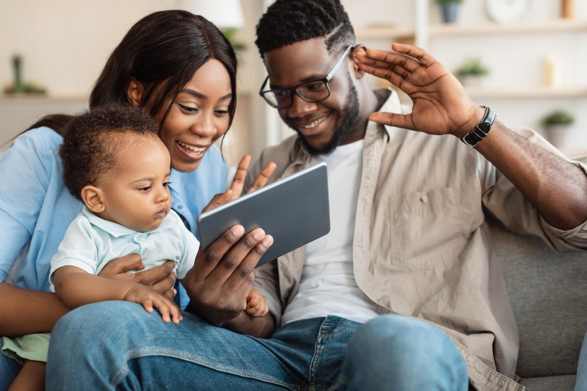 family having video call using tablet