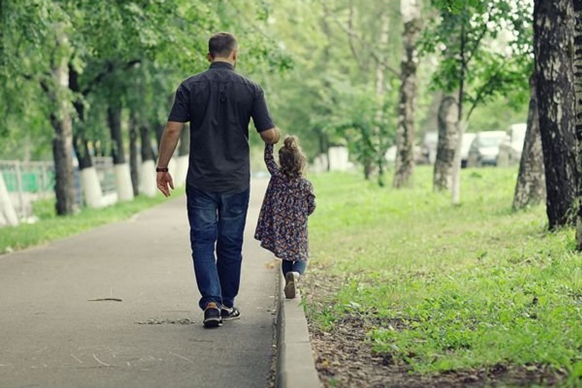 father and daughter walking