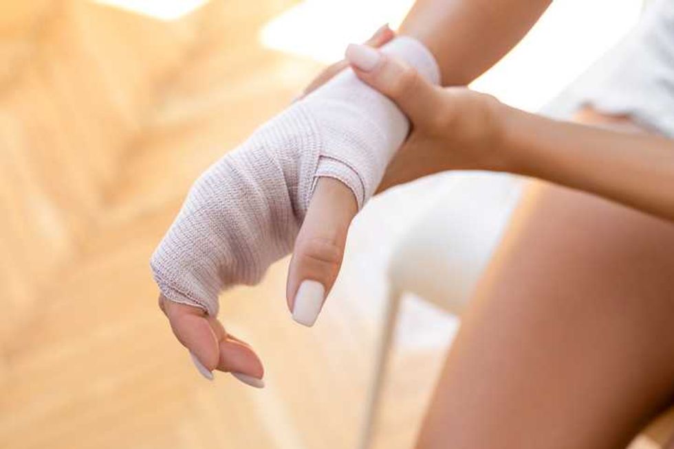 female hand bandaged