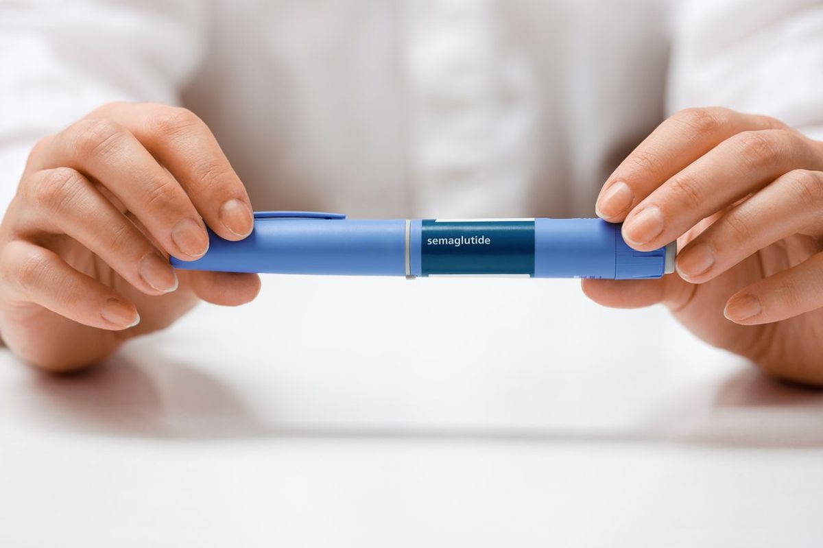 Female hands holding Semaglutide injection pen