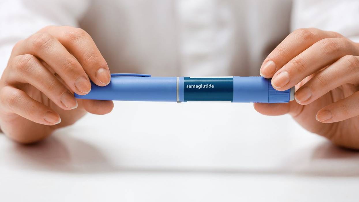 Female hands holding Semaglutide injection pen