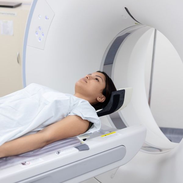 Female patient lying down ready for a CAT scan at the hospital