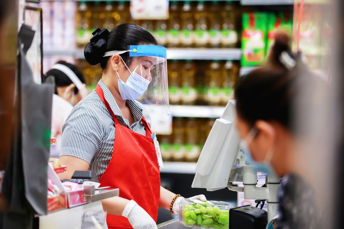 Female supermarket cashier