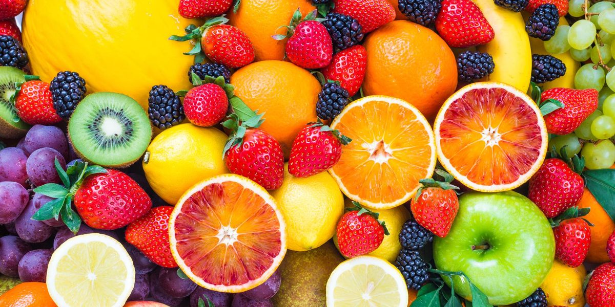 Fresh mixed fruits background.Organic fruits multicolor background.