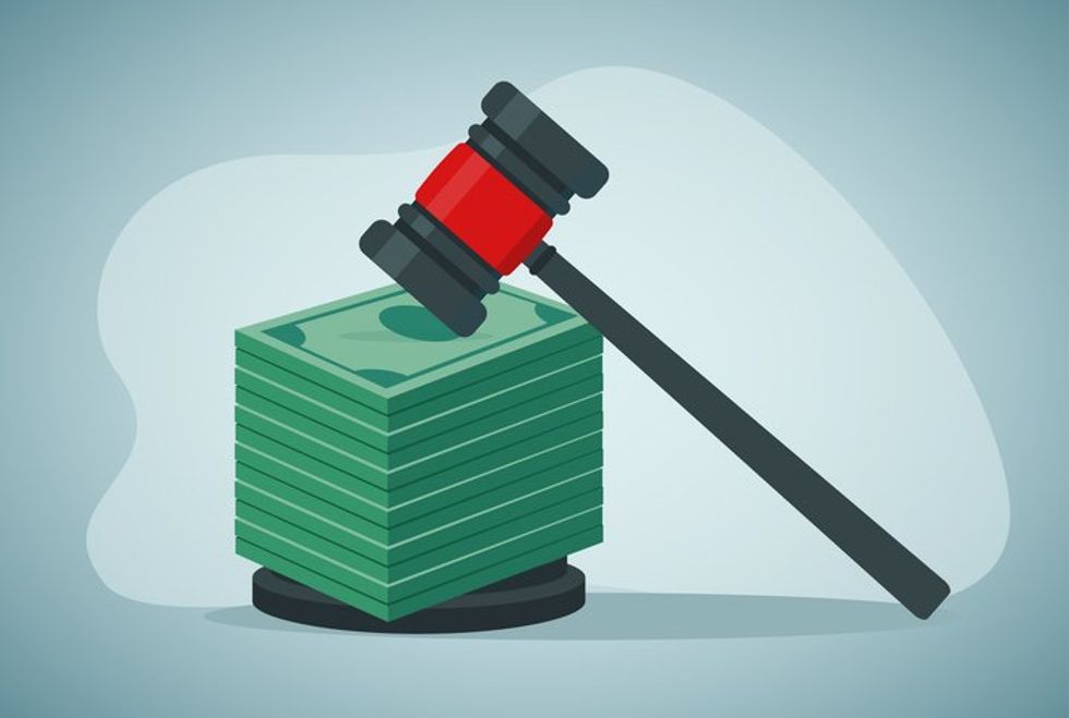 Gavel with stack paper currency