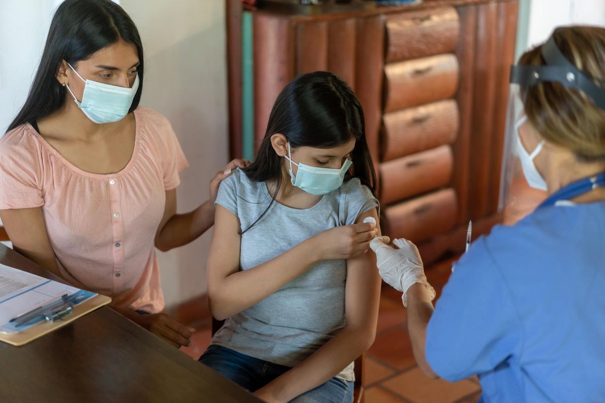Girl getting a COVID-19 vaccine