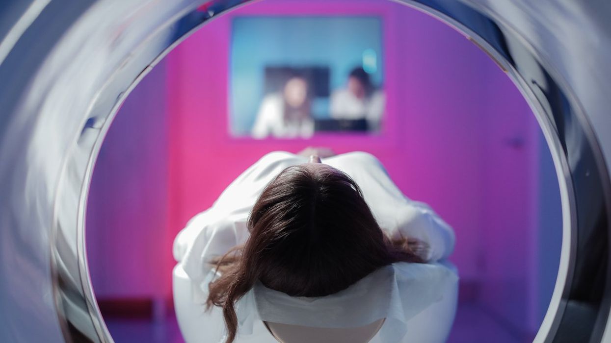 girl patient is lying in the tomograph and waiting for a scan