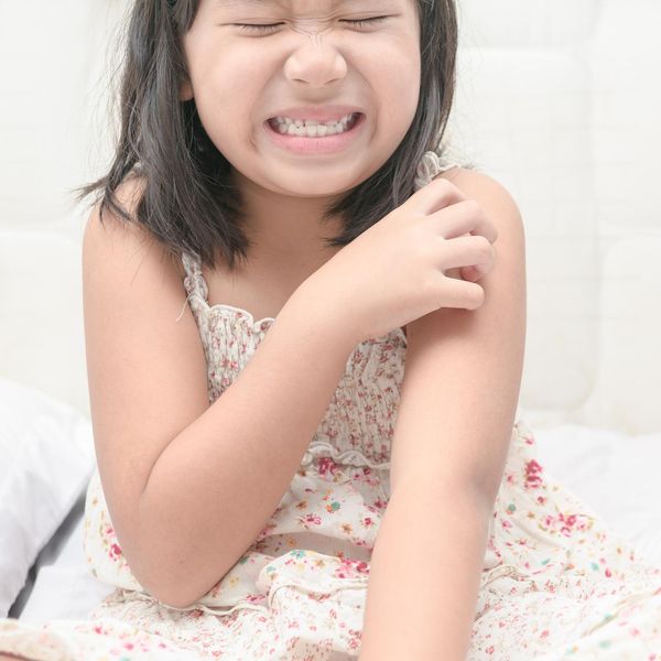 girl scratch the itch with hand