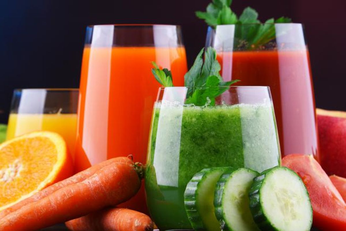 Glasses with fresh organic vegetable and fruit juices