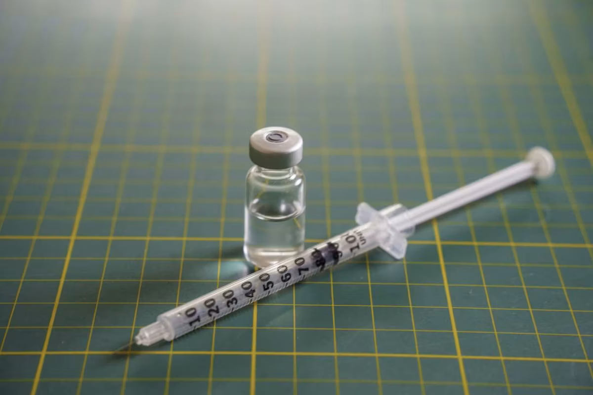GLP-1 syringe and transparent medication vial