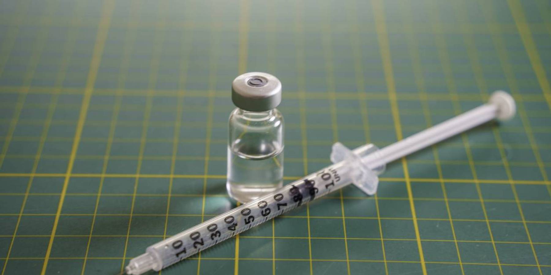 GLP-1 syringe and transparent medication vial