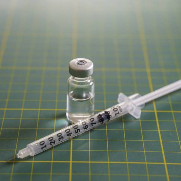 GLP-1 syringe and transparent medication vial
