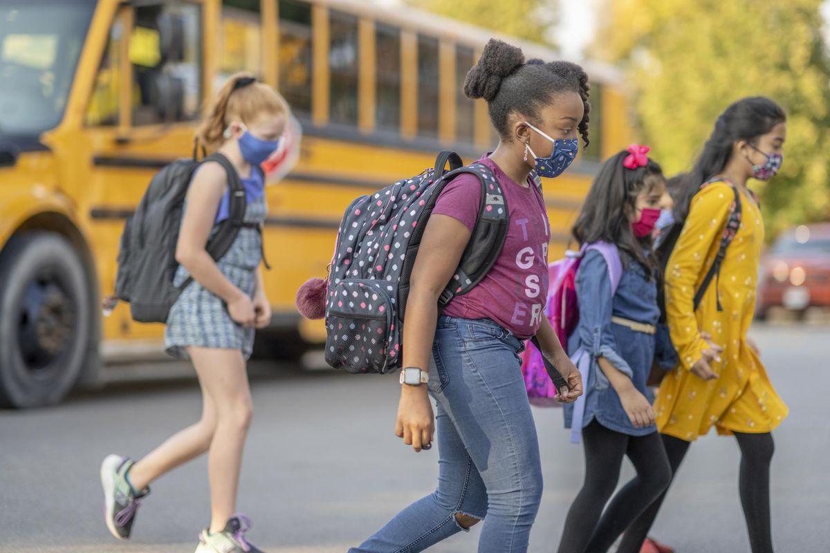 group of students getting off the bus