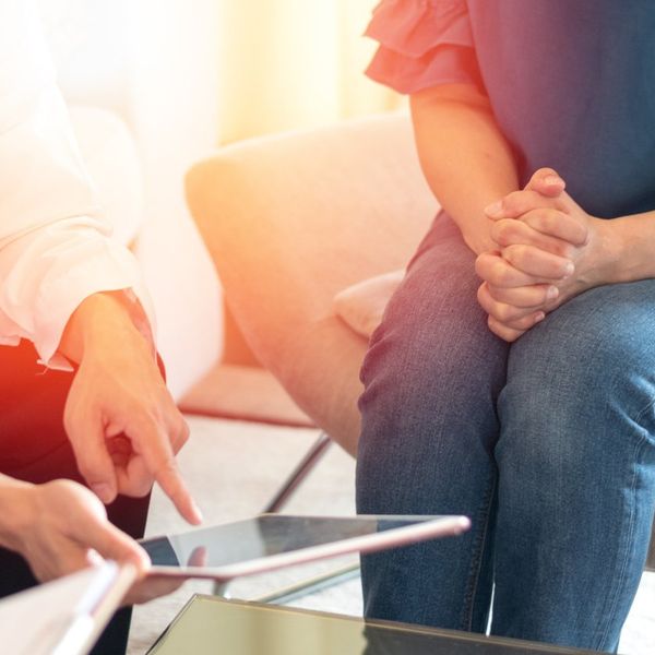 Gynecologist physician team consulting and examining woman patien