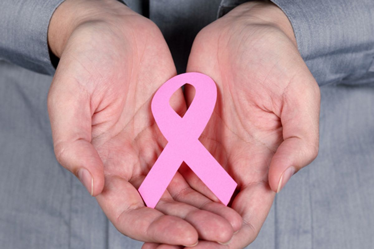 hands holding a breast cancer awareness ribbon