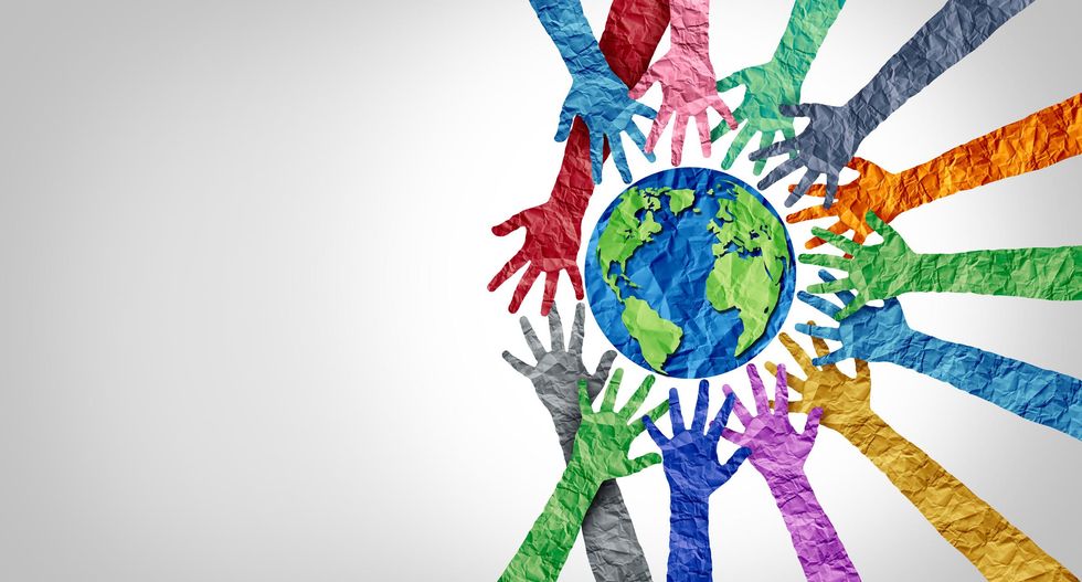 hands pointing to the world