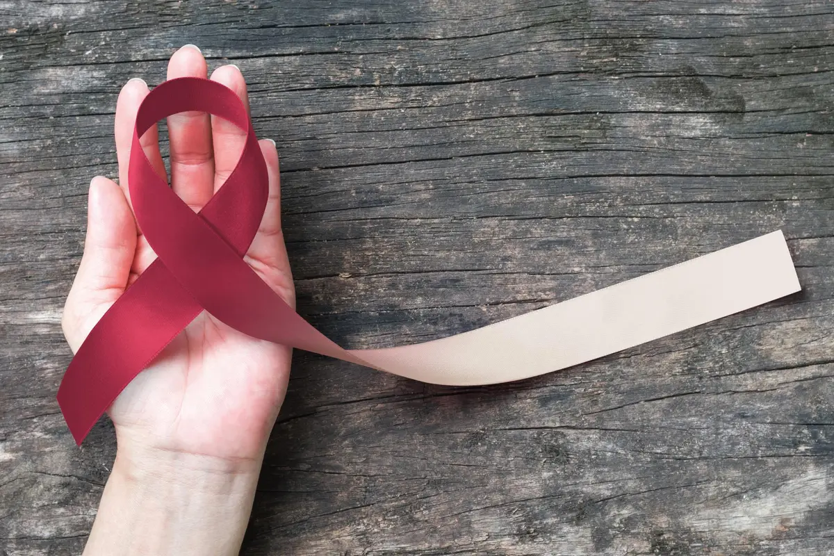 Head and neck cancer awareness with burgundy ivory color ribbon