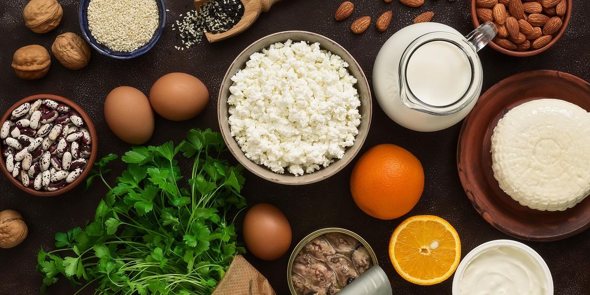 High calcium foods. Dairy products, beans, sardines, fruits, nuts. Nutrition for the healthy bones. Top view, flat lay