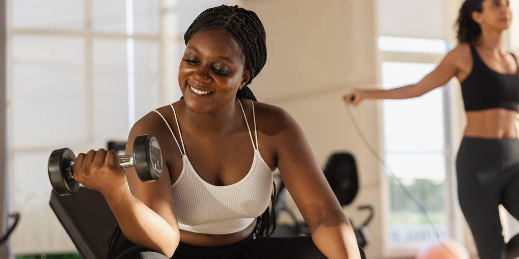 holding dumbbells lifts weights exercise in gym