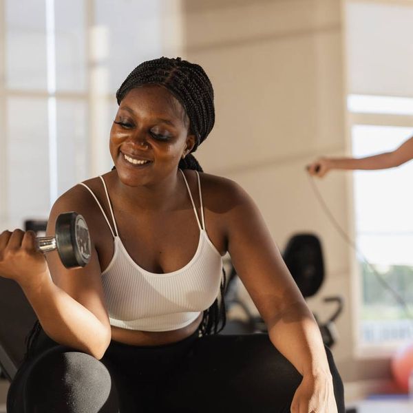 holding dumbbells lifts weights exercise in gym