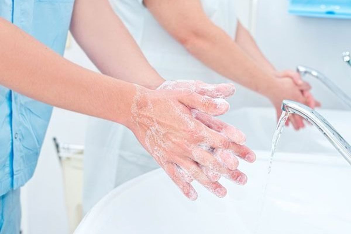 hospital workers washing their hands