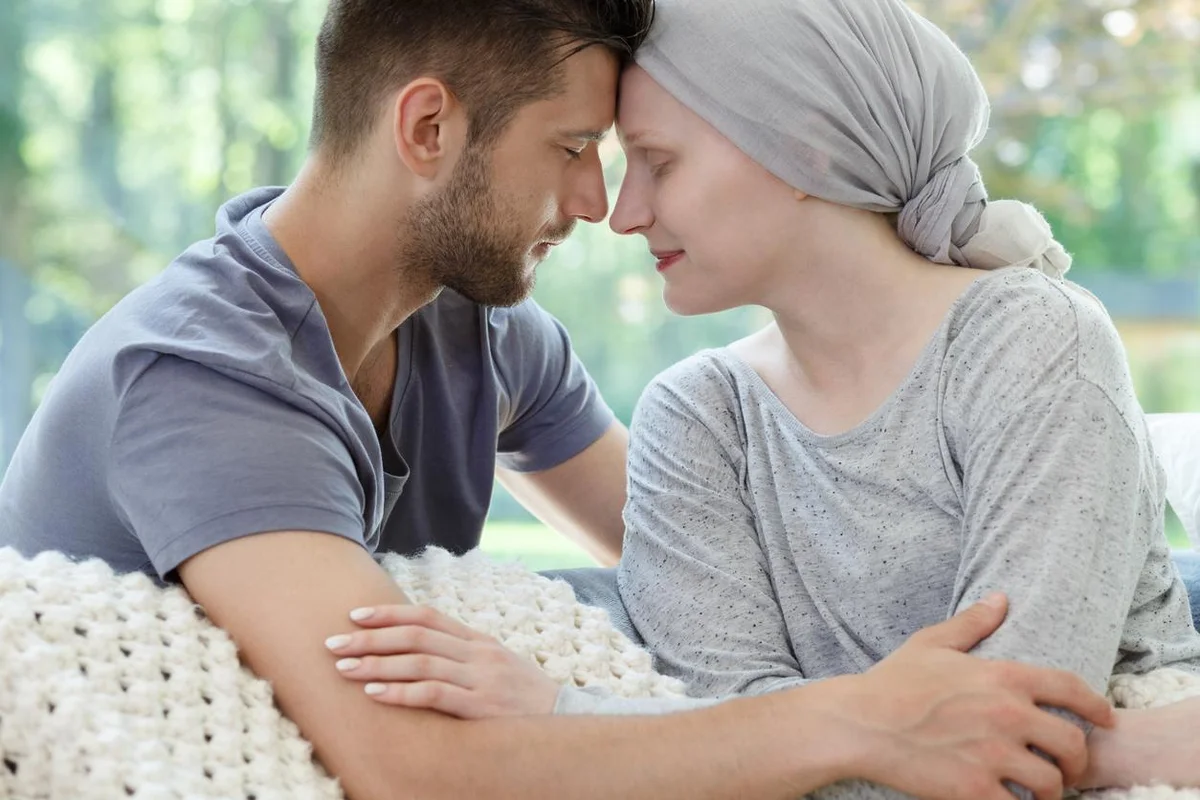 Husband and wife touching heads