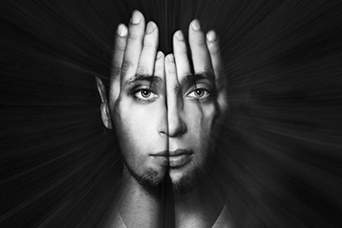image of man with hands in front of her face