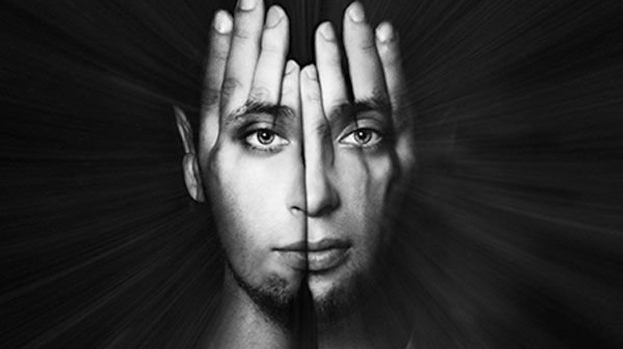 image of man with hands in front of his face