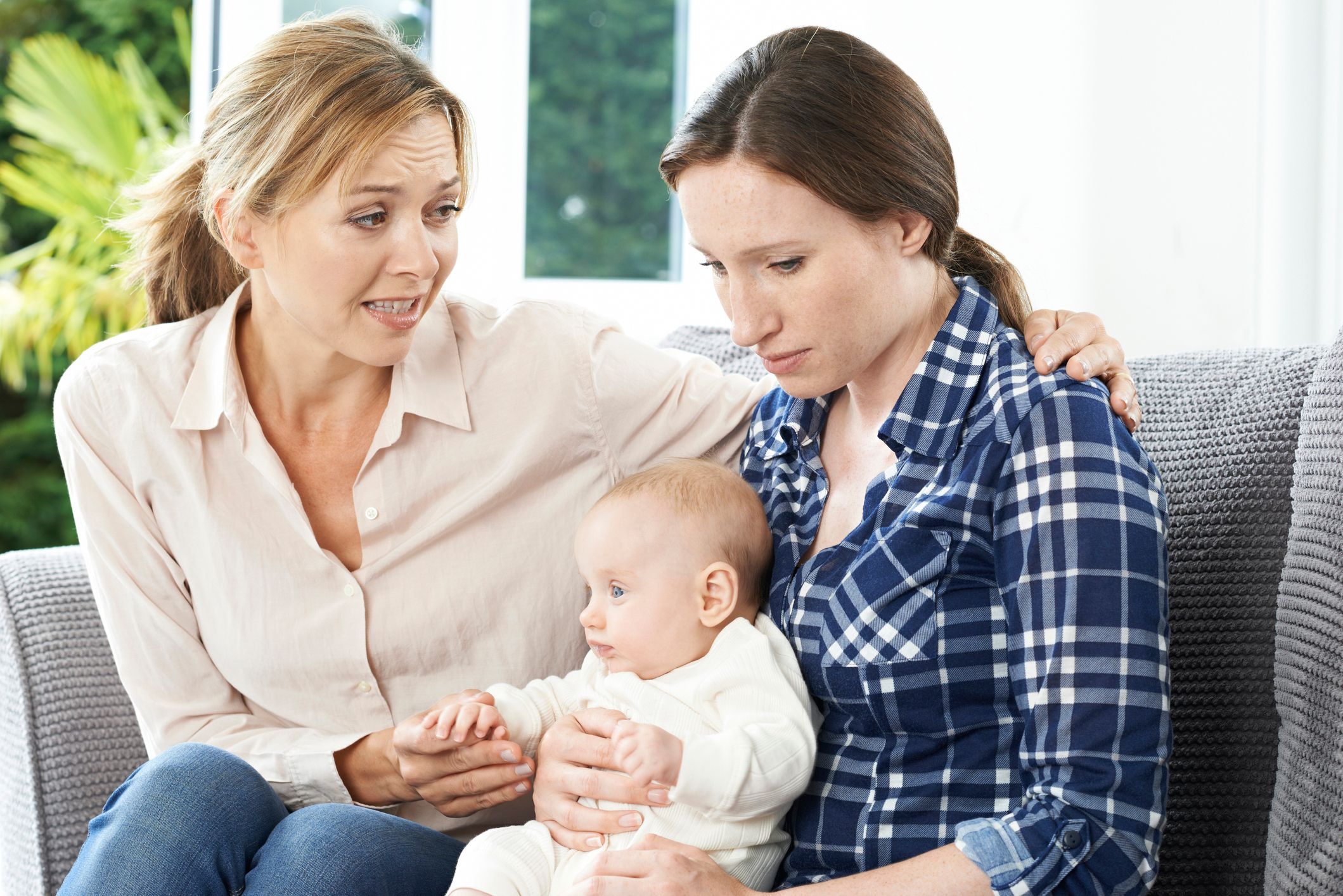 Mother Comforting Adult Daughter Suffering With Postpartum