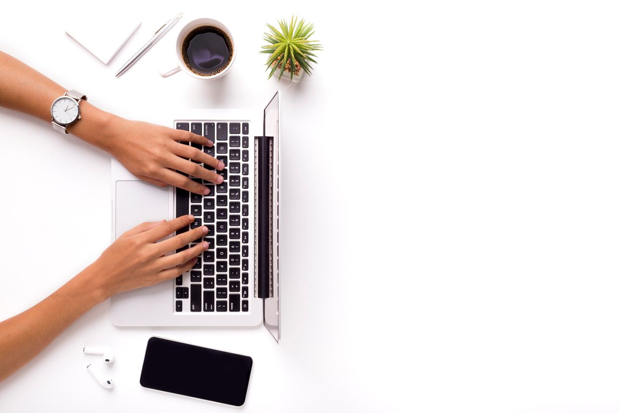 woman typing on a laptop