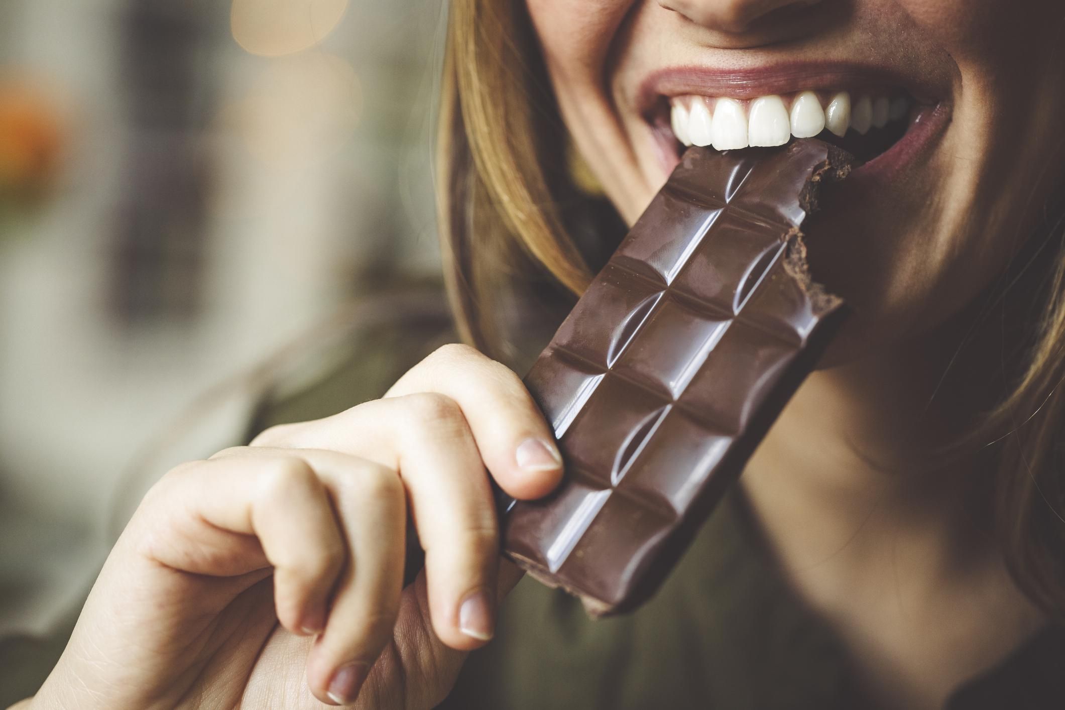 woman eating a chocolate bar