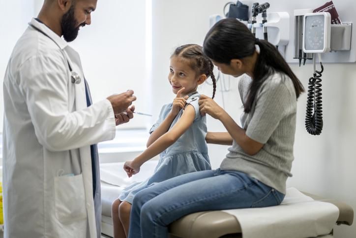 Little girl at a doctor's office for a vaccine injection
