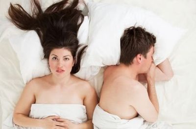 couple in bed after an awkward sex moment