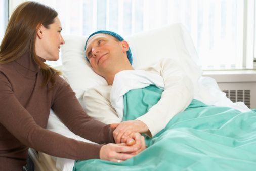 woman with her sick husband in the hospital