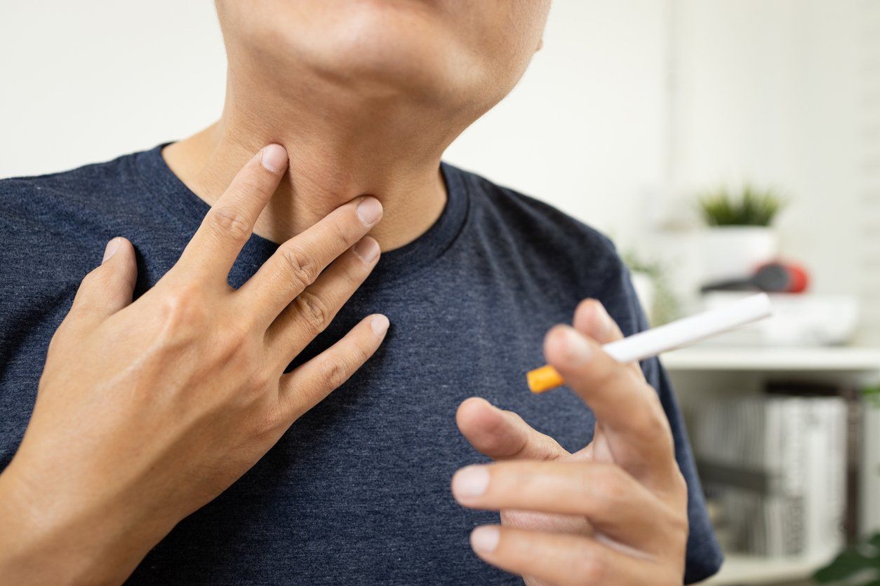 Neck of male smoker have a sore throat, painful and inflammation caused by smoking