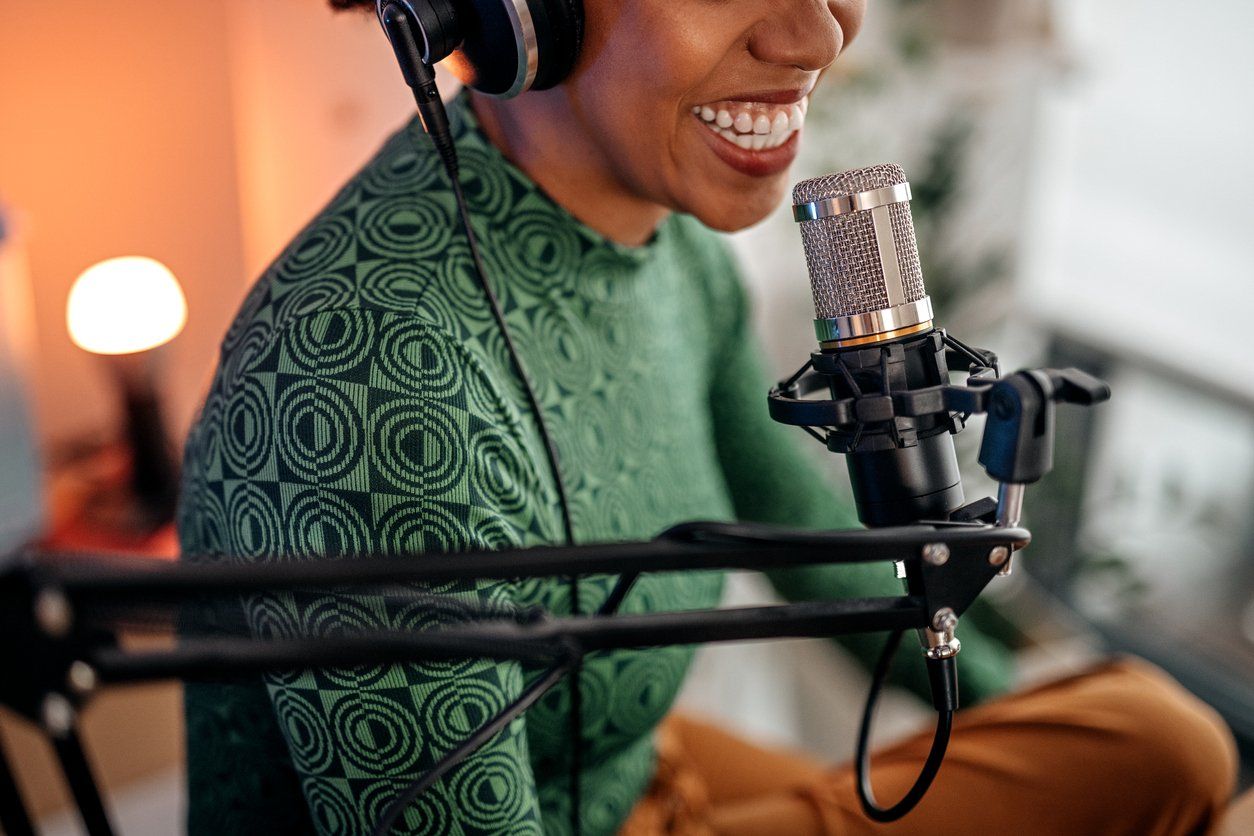 young woman recording podcast