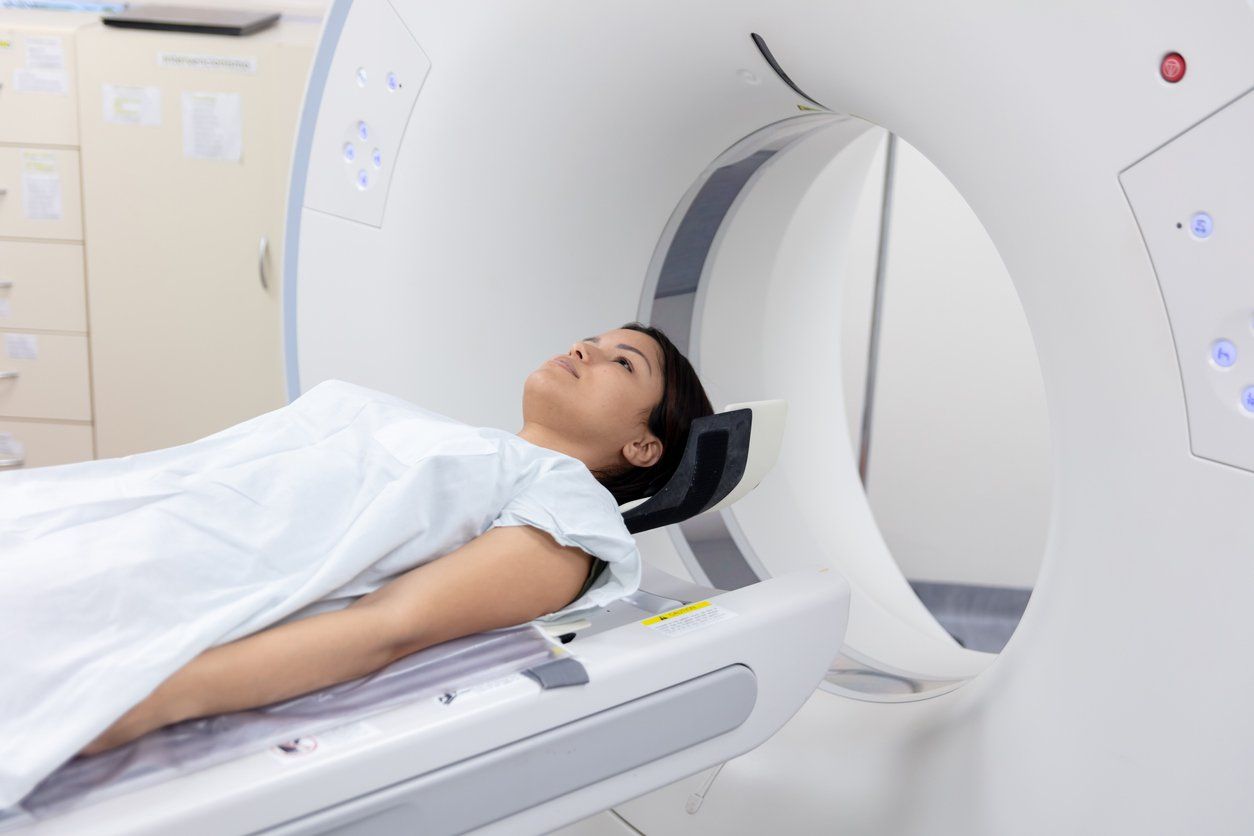 Female patient lying down ready for a CAT scan at the hospital